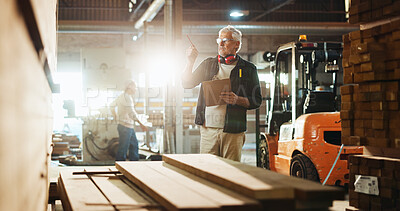 Buy stock photo Carpenter, man and clipboard with wood inspection for quality control, stock management or timber count. Manufacturing, mature person and paperwork for carpentry inventory or supply chain in workshop
