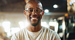 Workshop, black man and smile in portrait for carpenter, wood manufacturing and production business. Happiness, contractor and male person with glasses for safety, maintenance and plank craft