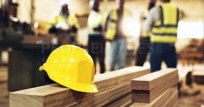 Buy stock photo Wood, carpentry and helmet for safety at warehouse with engineer group in meeting for construction planning. People,  carpenter and ppe in team with manufacturing, production and industry at factory