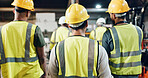 Group, men and engineer with back at factory for manufacturing, together and solidarity for artisan job. People, team and technician with helmet, synergy and ready for project at industrial warehouse