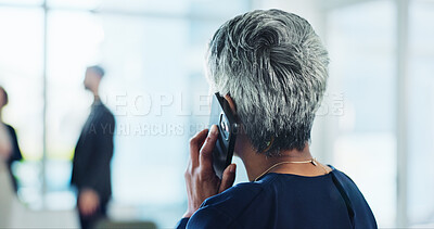 Buy stock photo Phone call, office and back of business woman with communication, contact and online discussion. Professional, corporate and mature person on smartphone for networking, planning and conversation