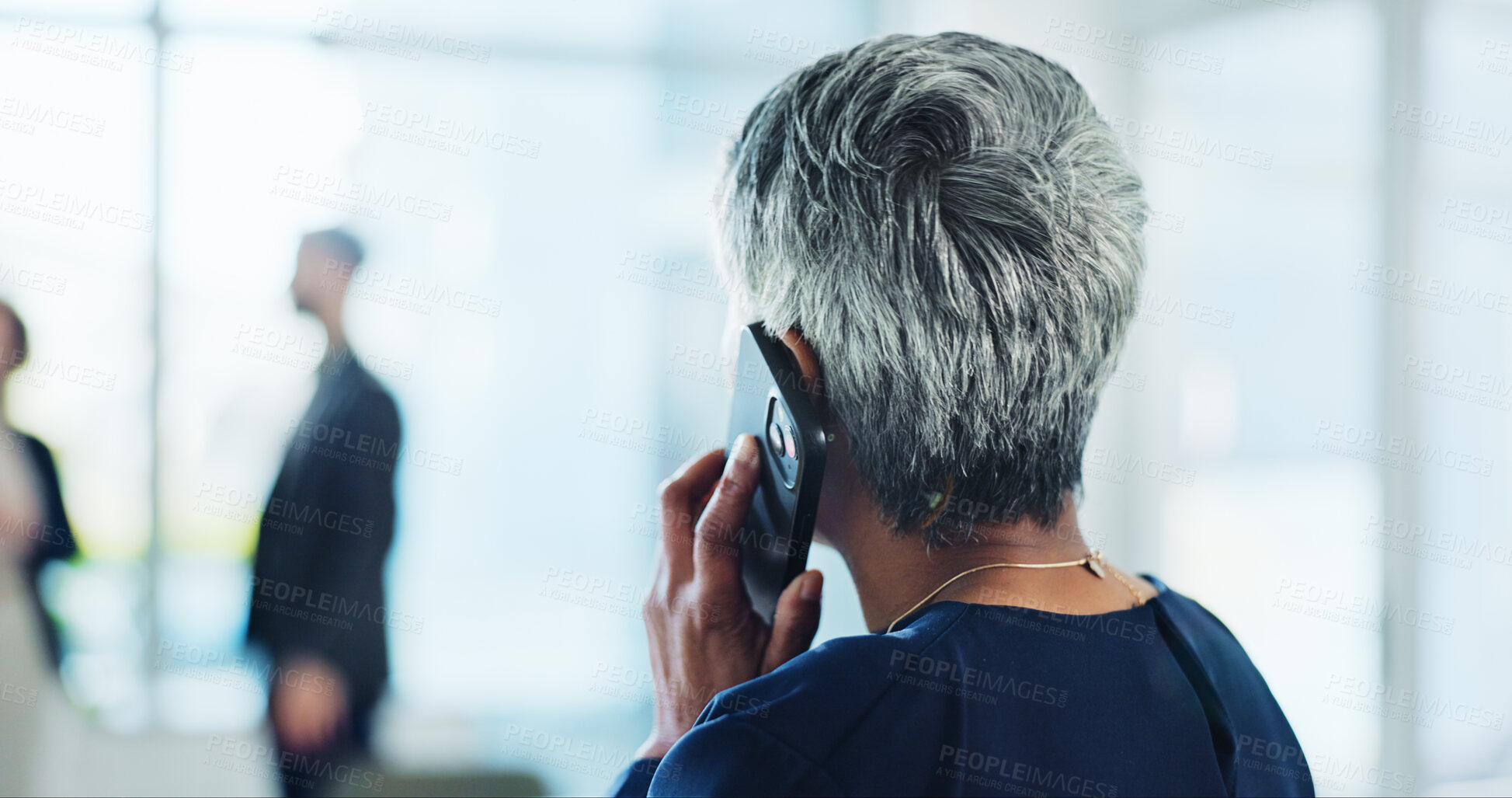 Buy stock photo Phone call, office and back of business woman with communication, contact and online discussion. Professional, corporate and mature person on smartphone for networking, planning and conversation
