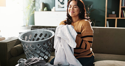 Buy stock photo Cleaning, laundry and satisfaction with woman on sofa in living room of home for household chores. Basket, towel and washing with happy person in apartment for daily housework or responsibility