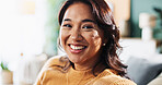 Portrait, relax and happy Asian woman in apartment for peace and calm on weekend in lounge. Face, smile and female person in living room with comfort, resting and chill on sofa in home in Thailand