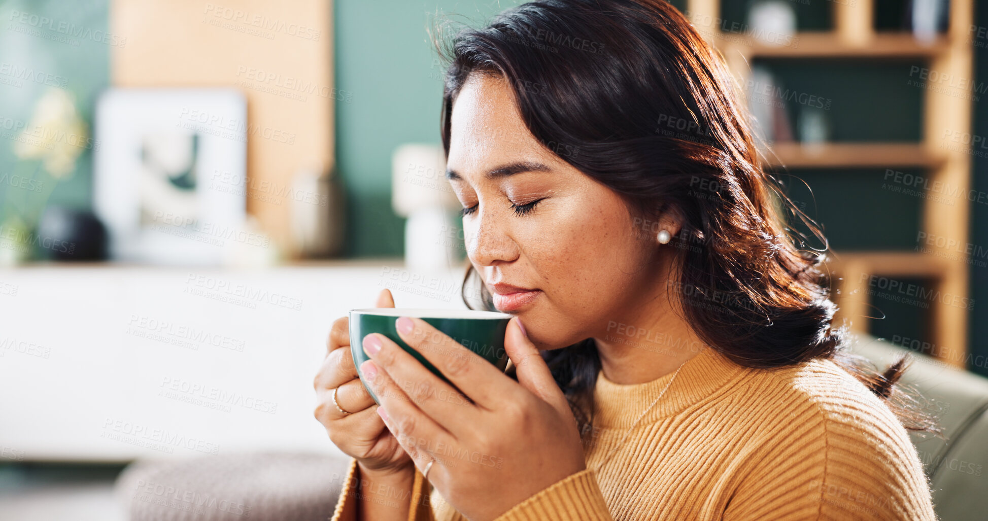 Buy stock photo Home, smell and woman on sofa, coffee and comfort with cappuccino in living room. Apartment, start day or happy person on couch, morning or herbal tea with aroma, caffeine or espresso with mocha brew