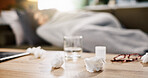 Pills, sick and tissue with woman on sofa for medical recovery, illness and flu season. Disease, fatigue and fever with person and medicine in living room at home for virus outbreak and cold