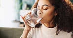 Woman, water and drink with glass for hydration, medication or daily drug dosage on sofa at home. Female person, patient or mineral liquid for natural sustainability, thirst or medical prescription
