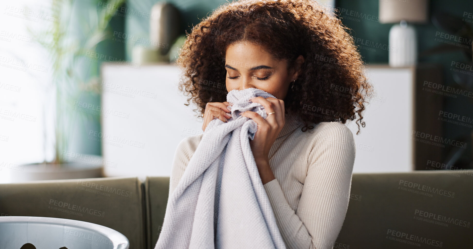 Buy stock photo Laundry, woman and smell fabric in home for fresh scent, detergent fragrance or spring cleaning. Washing basket, housewife and clothes aroma on sofa for housekeeping, domestic chores or linen comfort