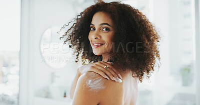 Buy stock photo Woman, lotion and shoulder in portrait, bathroom and moisturizer application for skin wellness. Person, cream and product with smile, results or benefits with self care routine at apartment in Brazil