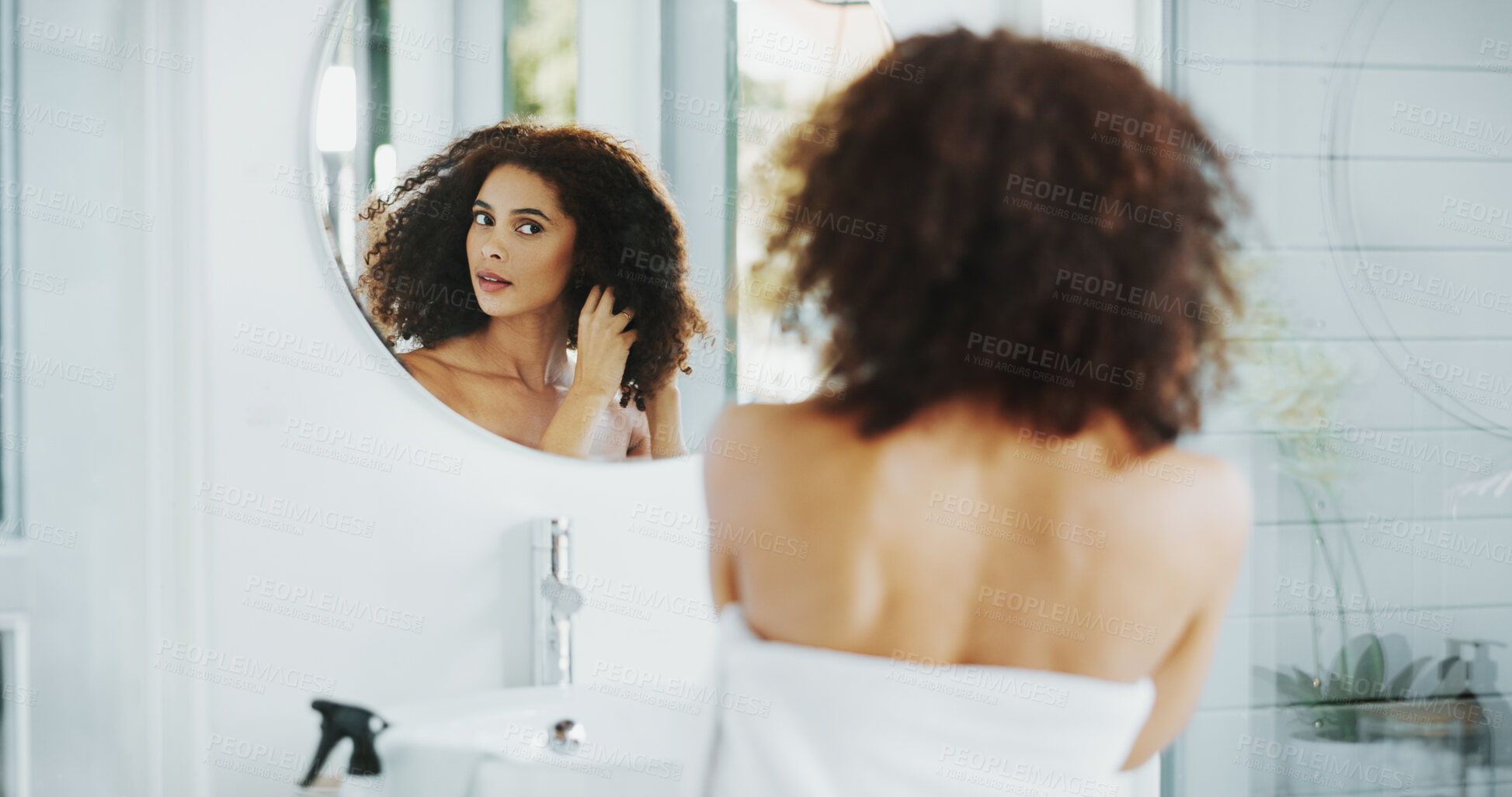 Buy stock photo Woman, afro and hair care by mirror with grooming for check, growth and volume in bathroom at house. African person, reflection and morning routine for hairstyle, results and curly texture in home