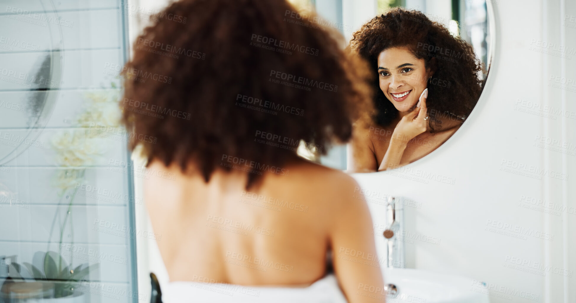 Buy stock photo Woman, afro and pad by mirror with skincare for beauty, wellness and glow in bathroom at house. African person, reflection and morning routine for cosmetics, results and facial cleaning at apartment