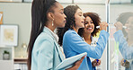 Writing, brainstorming and women with ideas, glass and colleagues with smile for meeting and business. Group, employees and people with sticky notes, public relations and collaboration in office
