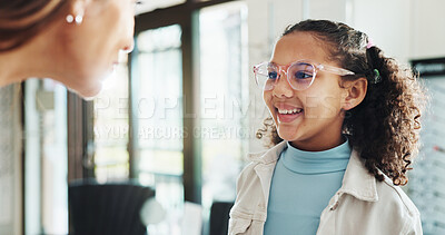 Buy stock photo Happy girl, glasses and optometry with lens for eyecare, sight or vision aid at optometrist. Little child, kid or spectacles with smile for eyewear advice, service or assistance at optician store