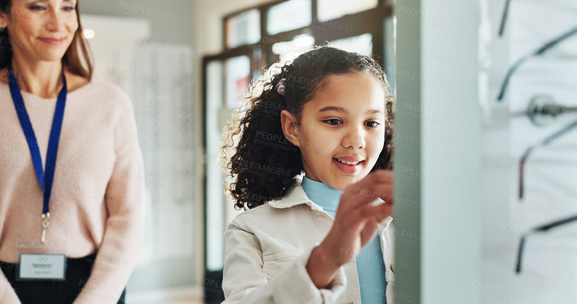 Buy stock photo Optometry, glasses and woman with child to choose frames, prescription lens and spectacles for sight. Healthcare, ophthalmology and optician with girl for eye care, vision and medical service choice