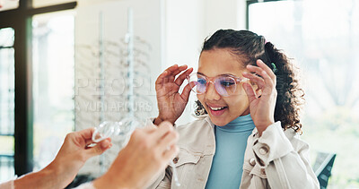 Buy stock photo Happy child, glasses and optometry with lens for eyesight, vision aid or care at optometrist shop. Girl, kid or spectacles with smile for eyewear advice, service or assistance at optician store