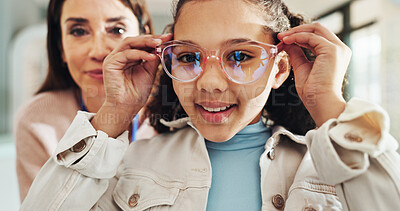 Buy stock photo Eyewear, optometry and portrait of girl with woman in hospital for appointment, checkup and eye care. Frame, glasses or vision with child and optometrist in clinic for ophthalmology consulting