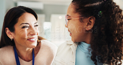 Buy stock photo Eyewear, smile or vision with girl and woman in hospital for appointment, checkup and eye care. Frame, glasses or prescription with happy child and optometrist in clinic for ophthalmology consulting