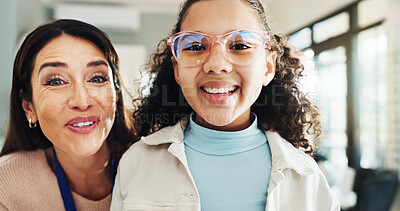 Buy stock photo Eyewear, portrait or vision with child and optometrist in hospital for appointment, checkup and eye care. Frame, glasses or prescription with girl and woman in clinic for ophthalmology consulting
