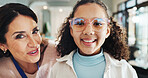 Glasses, optometry or portrait with girl and woman in hospital for appointment, checkup and eye care. Eyewear, frame or prescription with child and optometrist in clinic for ophthalmology consulting