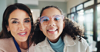Buy stock photo Eyewear, portrait or vision with girl and woman at optometrist for appointment, checkup and eye care. Frame, glasses or prescription with child and optometry professional in clinic for consulting