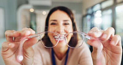 Buy stock photo Glasses, portrait and view of customer with optometrist in hospital for appointment or checkup pov. Frame, hands and prescription lenses with happy woman in clinic for eyewear, optometry or vision