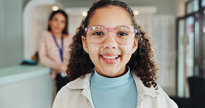 Buy stock photo Optometry portrait, child and shopping for glasses in retail store for eye care, optical correction or frame fitting. Happy girl, customer or eyewear prescription with lens choice, vision or face