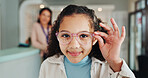 Optometry store, child and portrait with glasses for eye care, vision or frame shopping. Happy girl, customer and eyewear fitting for lens choice, size and optical healthcare for eyesight or wellness