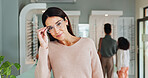 Choice, portrait or woman with glasses at store for optometry, eyewear or shopping. Female person, frames and checking spectacles at retail for sight, vision or decision at optician or optometrist