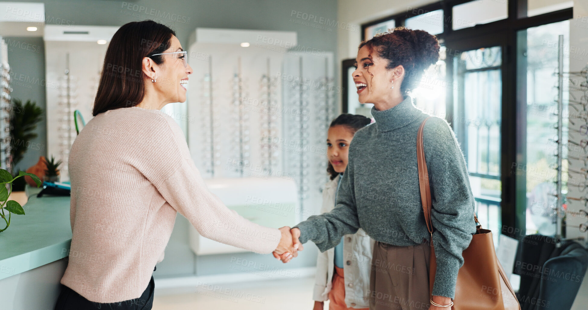 Buy stock photo Woman, handshake or greeting with optometrist for eyecare, sight or vision at optometry store. Parent, shaking hands and child with thank you for eye lens, assistance or advice on glasses at optician