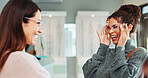 Glasses shopping, happy and woman with optician in retail store for eyewear choice, laughing and funny joke. Optometry service, person or customer with spectacles fitting for optical health or vision