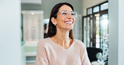 Buy stock photo Customer, happy or woman with glasses at optometrist for optometry, eyewear or shopping. Excited client, smile or checking spectacles frames at optical store for sight, vision or decision at optician
