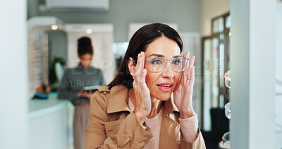 Buy stock photo Optometry, woman and glasses shopping in mirror for lens fitting, prescription frame and spectacles choice. Mature person, check and eye care for vision correction, healthcare and eyesight in store
