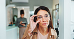 Eye care, woman and glasses choice in mirror for frame shopping, prescription lens size and eyewear fitting. Mature person, eyesight and check for vision correction and optical health in retail store