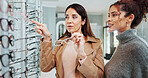 Eye care, woman and customer with glasses choice for optometry, prescription lens or pointing to frame style. Optician, person or happy with spectacles decision for vision, eyesight or health service