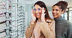 Optician, happy and woman with glasses shopping in retail store for frame fitting, eyewear choice and checking mirror. Optometry, person and smile with spectacles decision, vision correction and sale