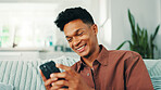 Funny, phone and happy man laughing in home on social media application or texting on weekend. News, meme or male person with smile on mobile message on sofa for comedy post, chat or dating website