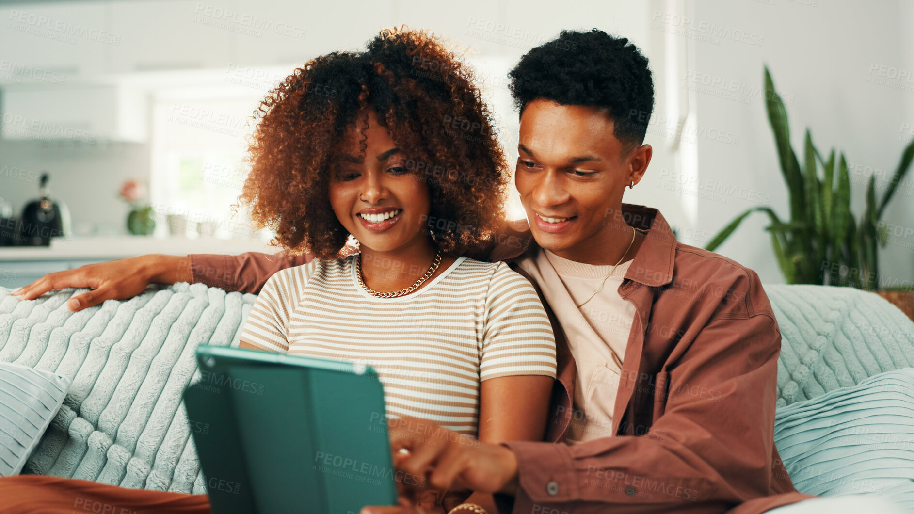 Buy stock photo Tablet, relax and couple on sofa in home with planning romantic vacation, holiday or getaway. Happy, digital technology and man with woman for booking flights for honeymoon trip in apartment.