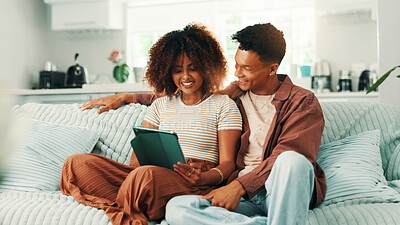 Buy stock photo Tablet, relax and couple in living room at home for scrolling on social media, website or app together. Happy, digital technology and man with woman for networking, connectivity or communication.
