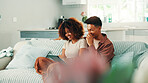 Couple, tablet and laugh at home with conversation, internet and browsing online. Man, woman and living room sofa for social media, meme or funny post or user video for entertainment in house
