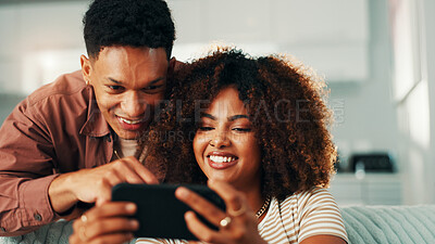 Buy stock photo Phone, couple and laugh at home with internet, online joke and browsing for meme. Man, woman and living room sofa for social media post, comedy or show funny video for entertainment in house