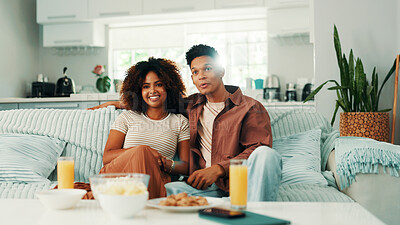 Buy stock photo Couple, lounge or watching tv to relax on sofa for romance, love or bonding together in home. Drinks, subscription or man on couch with woman or care for streaming film, television or series in house