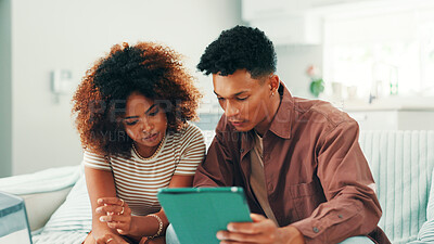 Buy stock photo Couple, tablet and reading at home with internet, blog advice and credit check. Man, woman and living room sofa for banking, future or serious about finance application for investment in house