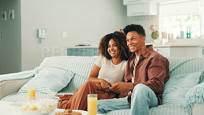 Buy stock photo Couple, watching tv and remote at home with laugh for movie, series and browsing online. Man, woman and living room sofa for bonding, press play or snack with subscription for entertainment in house