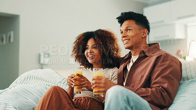 Buy stock photo Happy couple, juice or watching tv to relax in home for romance, love and bonding together. Smile, subscription and man on couch with woman, drinks and care for streaming film, television and series