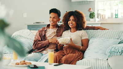 Buy stock photo Happy couple, popcorn or watching tv to relax in home for romance, love and bonding together. Juice, subscription and man on sofa with woman, drinks and smile for streaming film, television or series