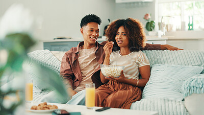 Buy stock photo African couple, watching tv and popcorn on sofa with smile, care and bonding with love, date and relax in home. Man, woman and happy with snack for streaming, movies or film on couch in living room