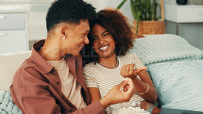 Buy stock photo Happy couple, comedy or popcorn for laughing in home for romance, love and bonding together. Funny movies, joke humor or man on sofa with woman or smile for streaming film, subscription or series