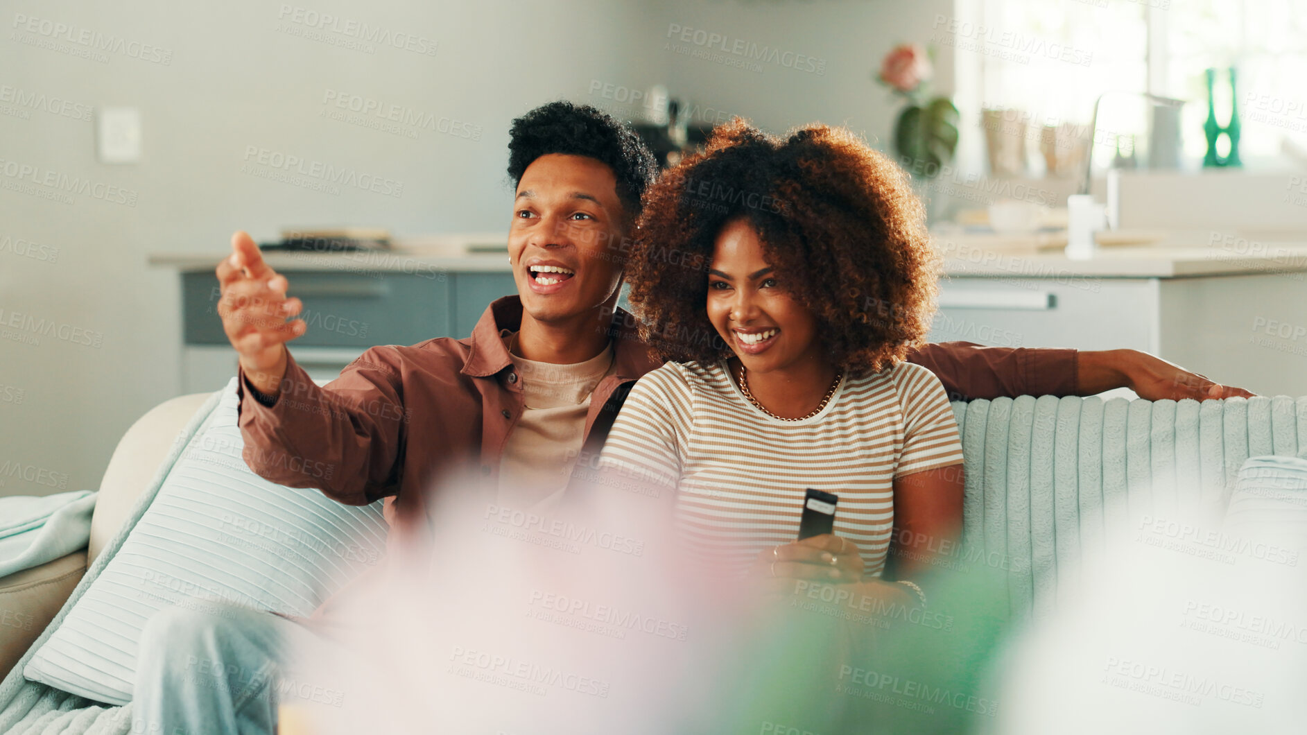 Buy stock photo Excited, couple or watching tv in home on sofa for funny movies, love and bonding together. Happy, subscription and man on couch with woman and smile for streaming film, television and comedy series