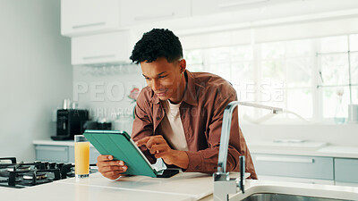 Buy stock photo Man, happy and tablet in kitchen, home and search for recipe, video and learning with subscription. Person, digital touchscreen and application for online course, smile and cooking lessons at house