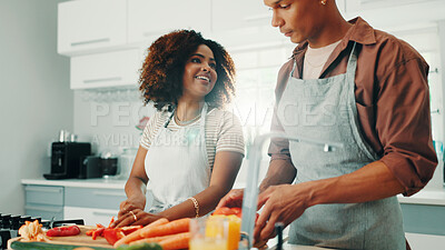 Buy stock photo Cooking, love and couple in kitchen in home for nutrition, wellness or healthy dinner together. Vegetables, bonding and man with woman for preparing diet meal for supper with vitamins in apartment.